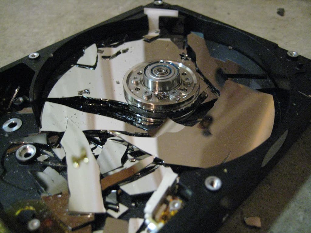 Shattered hard drive platters after physical data destruction